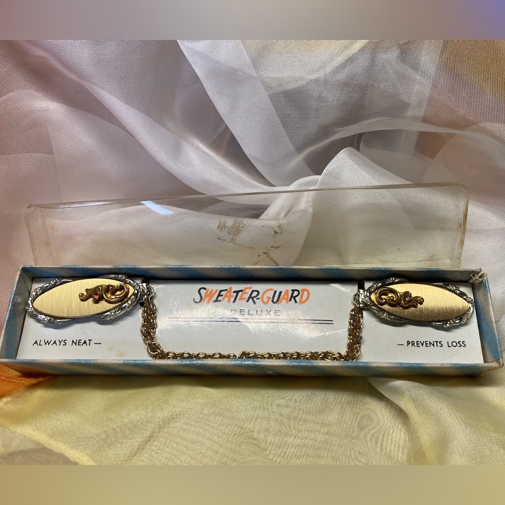 VINTAGE SWEATER-GUARD IN ORIGINAL BOX - UNSIGNED